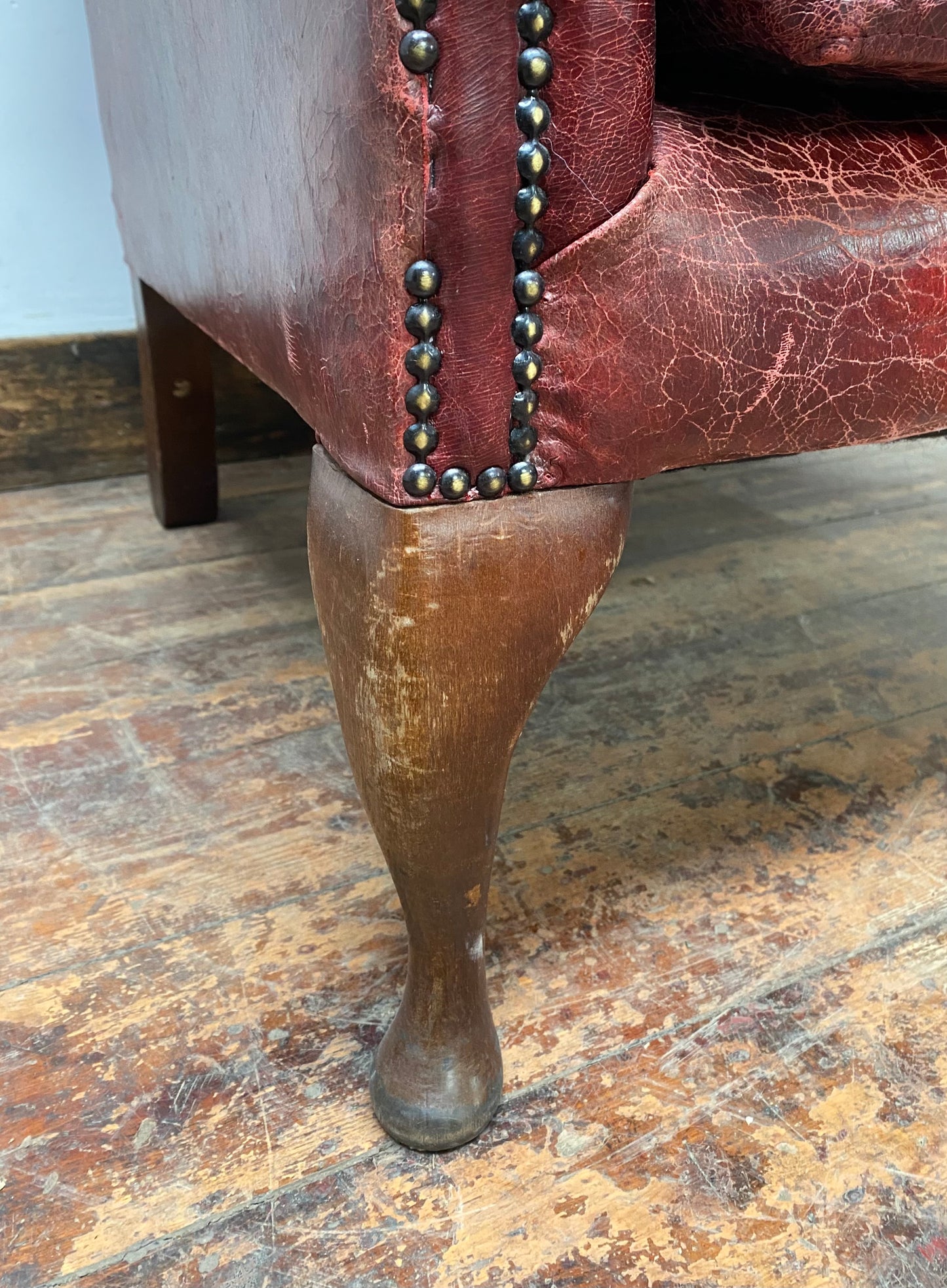 Stunning red leather wingback armchair