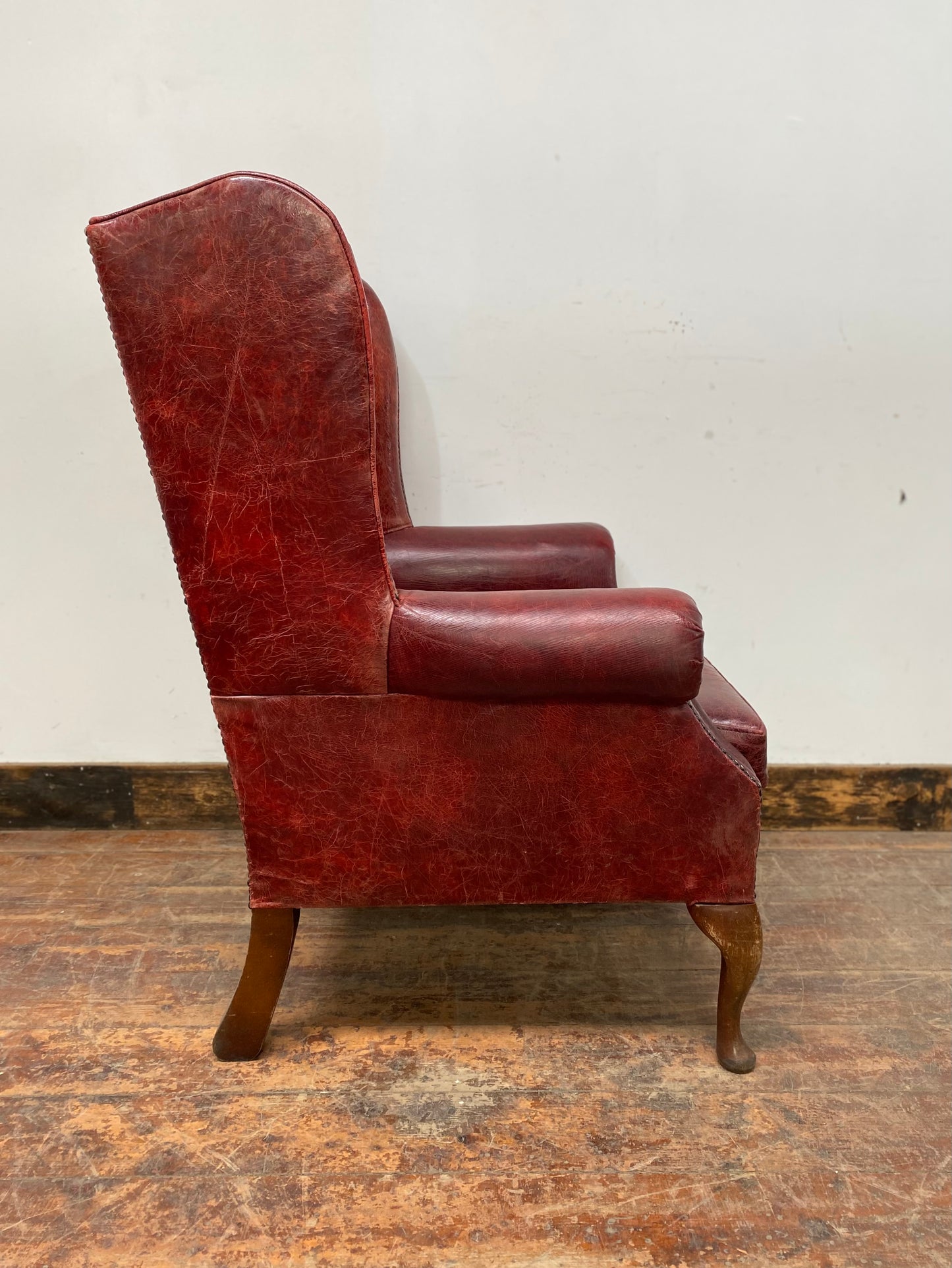 Stunning red leather wingback armchair