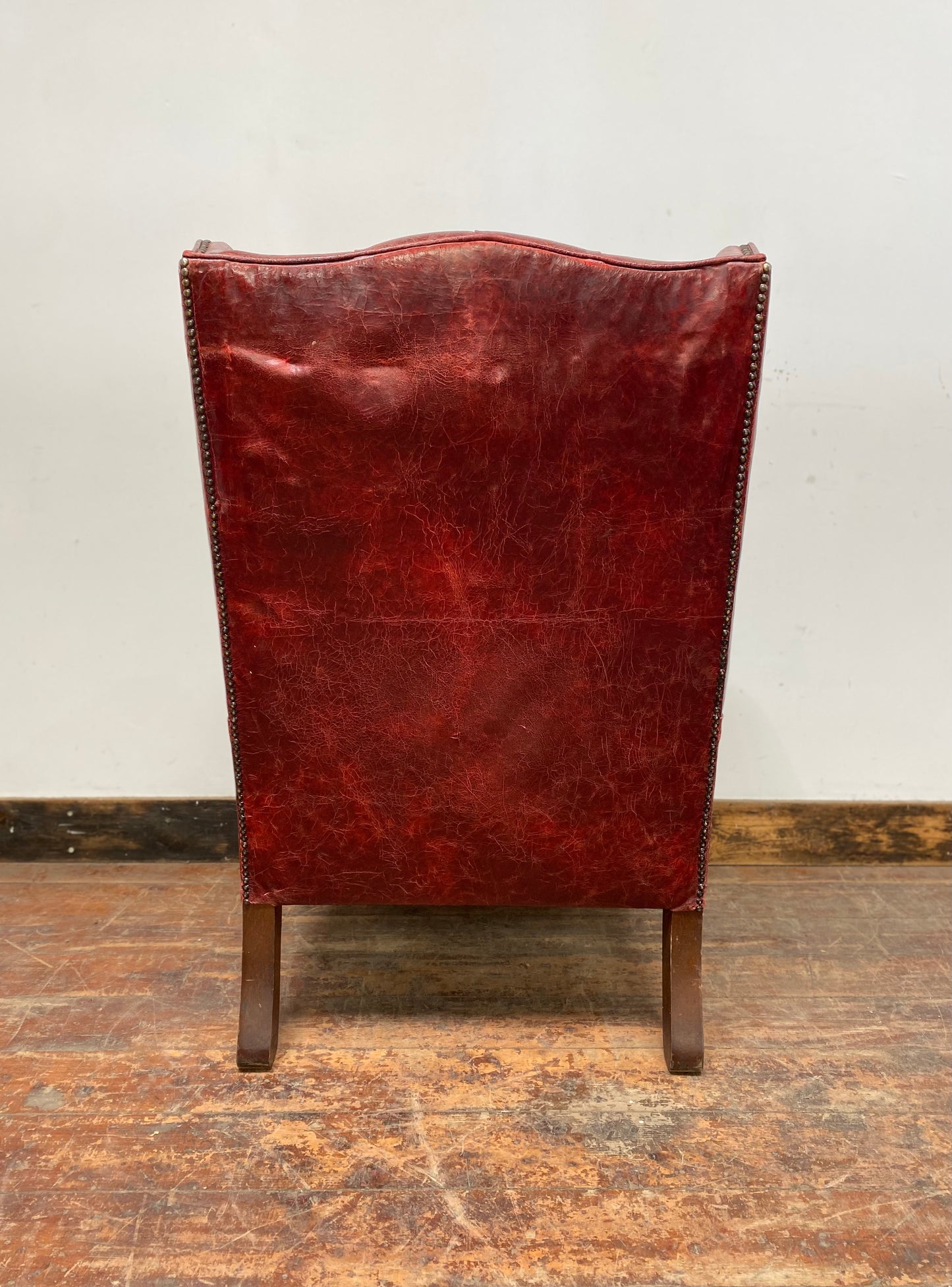Stunning red leather wingback armchair