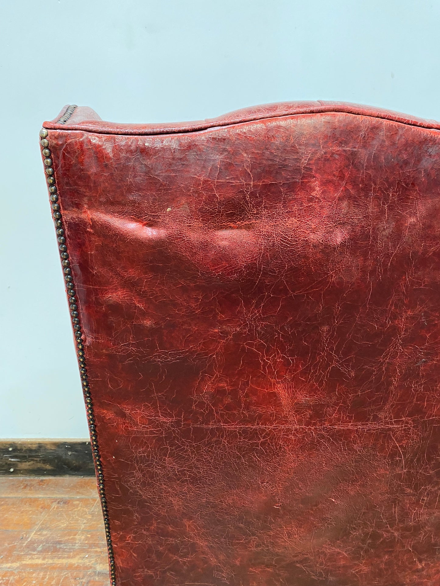 Stunning red leather wingback armchair