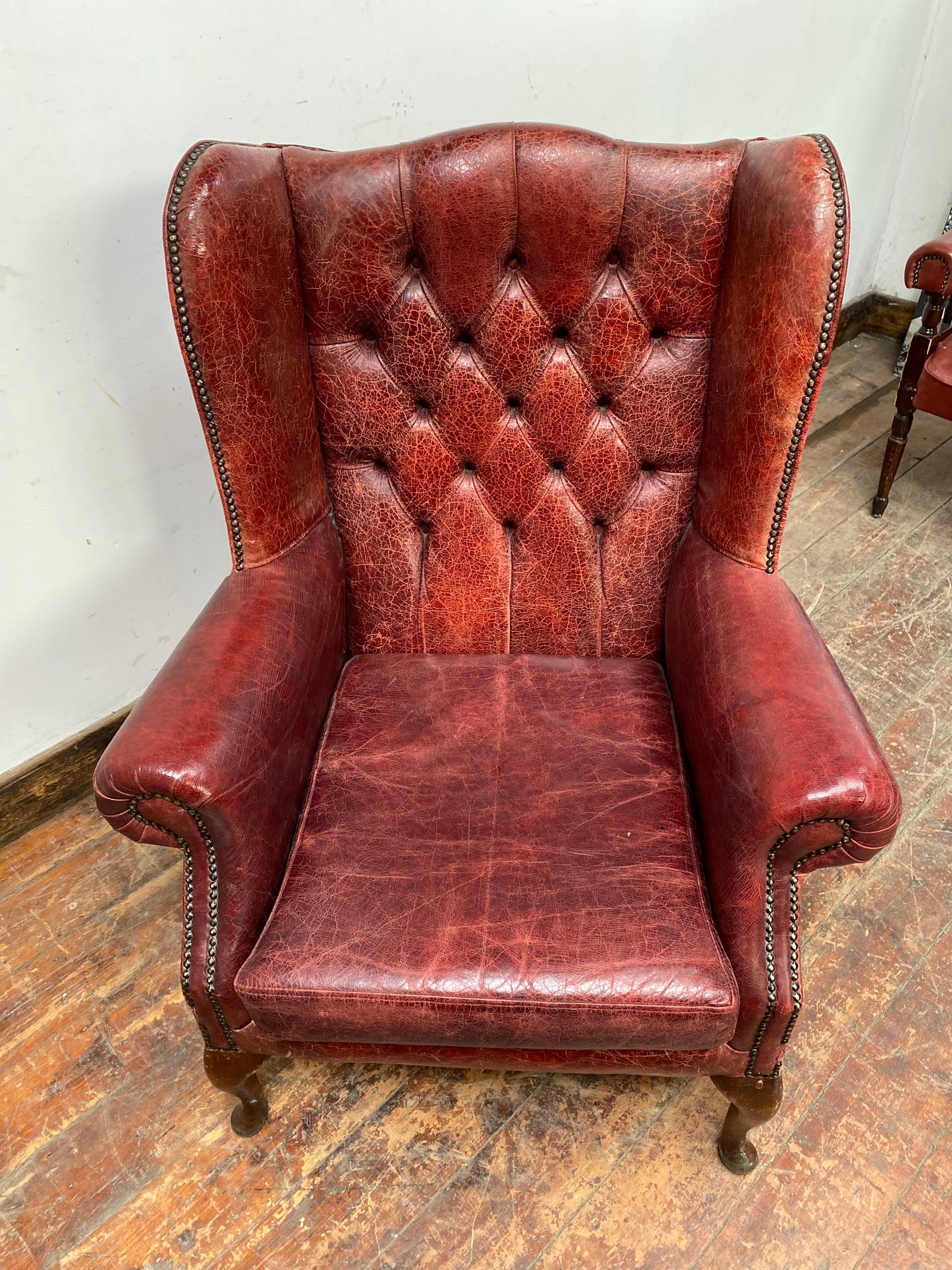 Stunning red leather wingback armchair