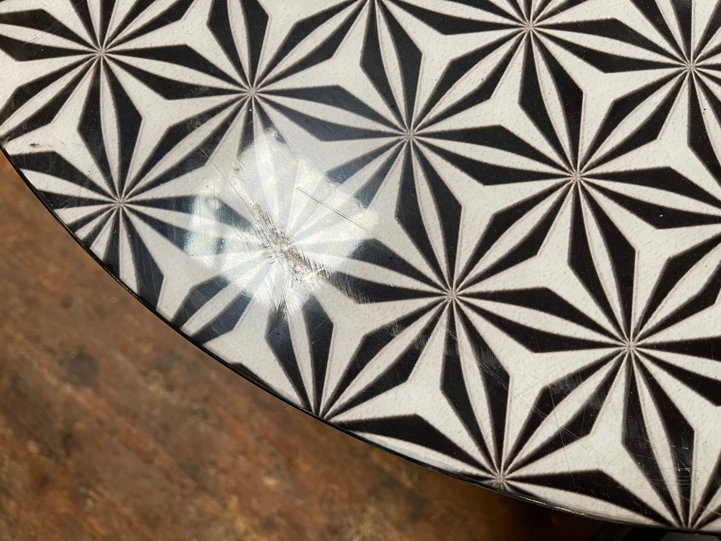 Black and white round coffee table with graphic print