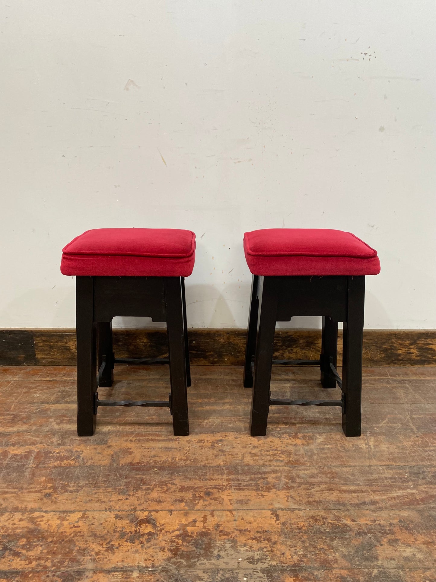 Low bar stools with red velvet-feel tops