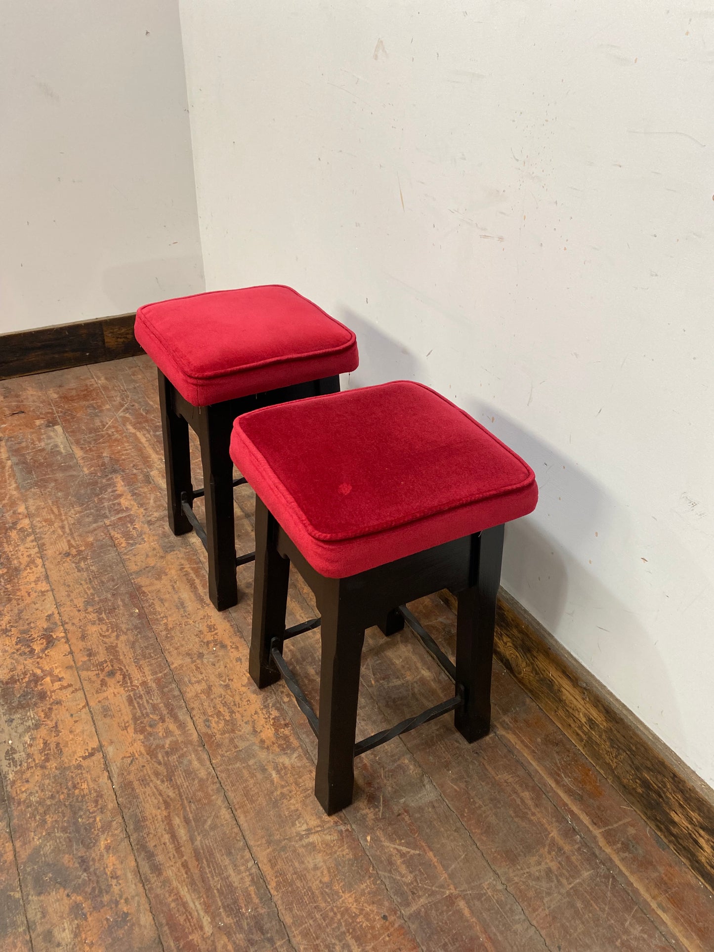 Low bar stools with red velvet-feel tops