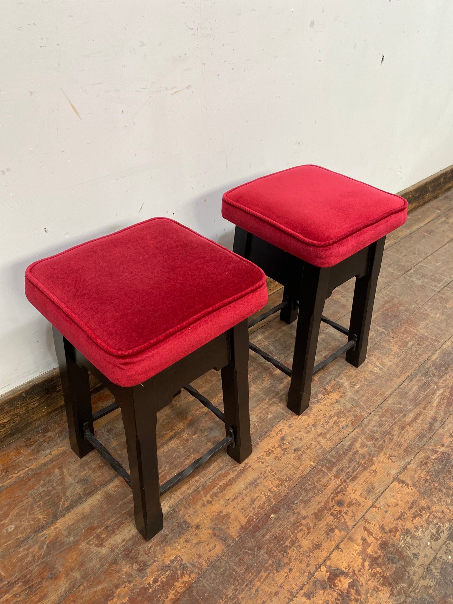 Low bar stools with red velvet-feel tops