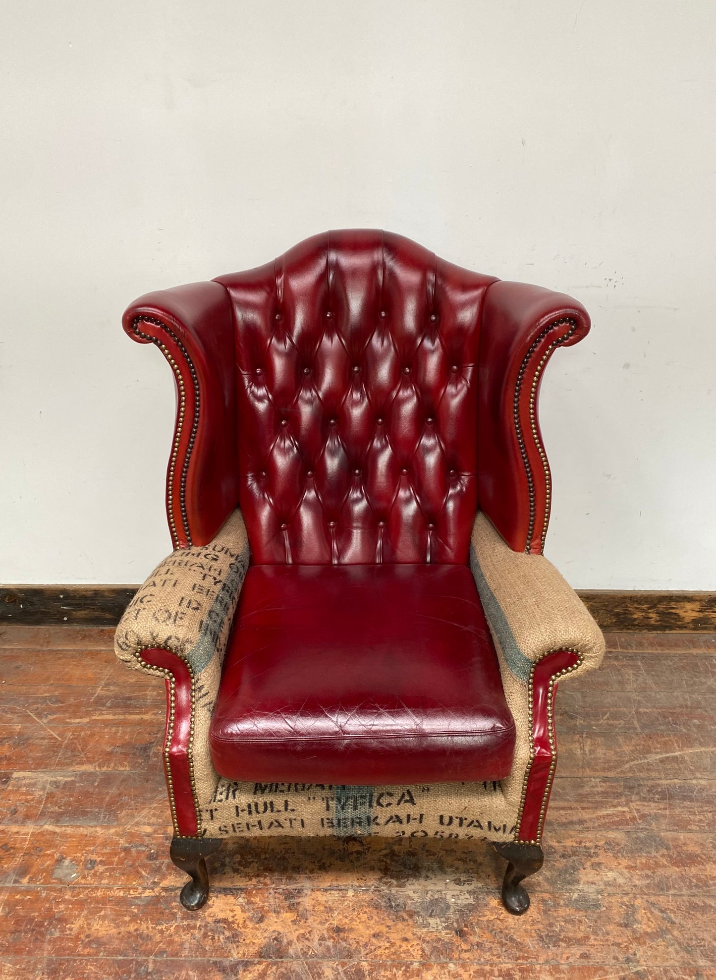 Deconstructed wingback armchair in red leather