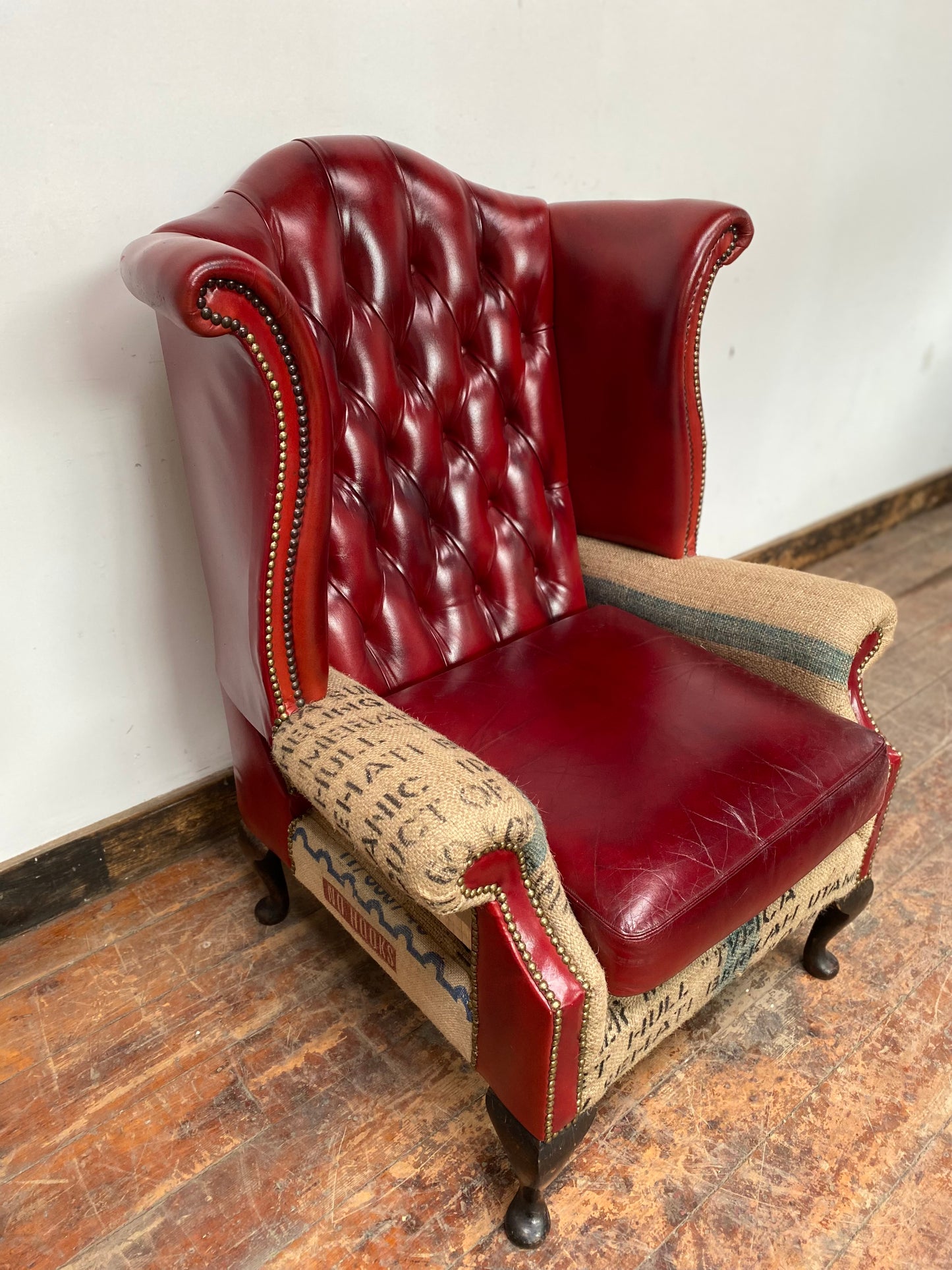 Deconstructed wingback armchair in red leather