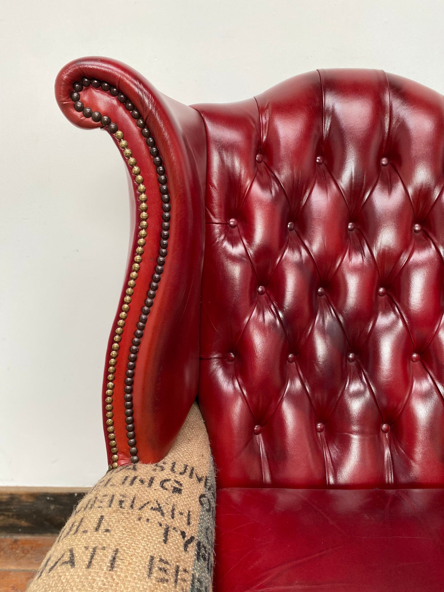 Deconstructed wingback armchair in red leather