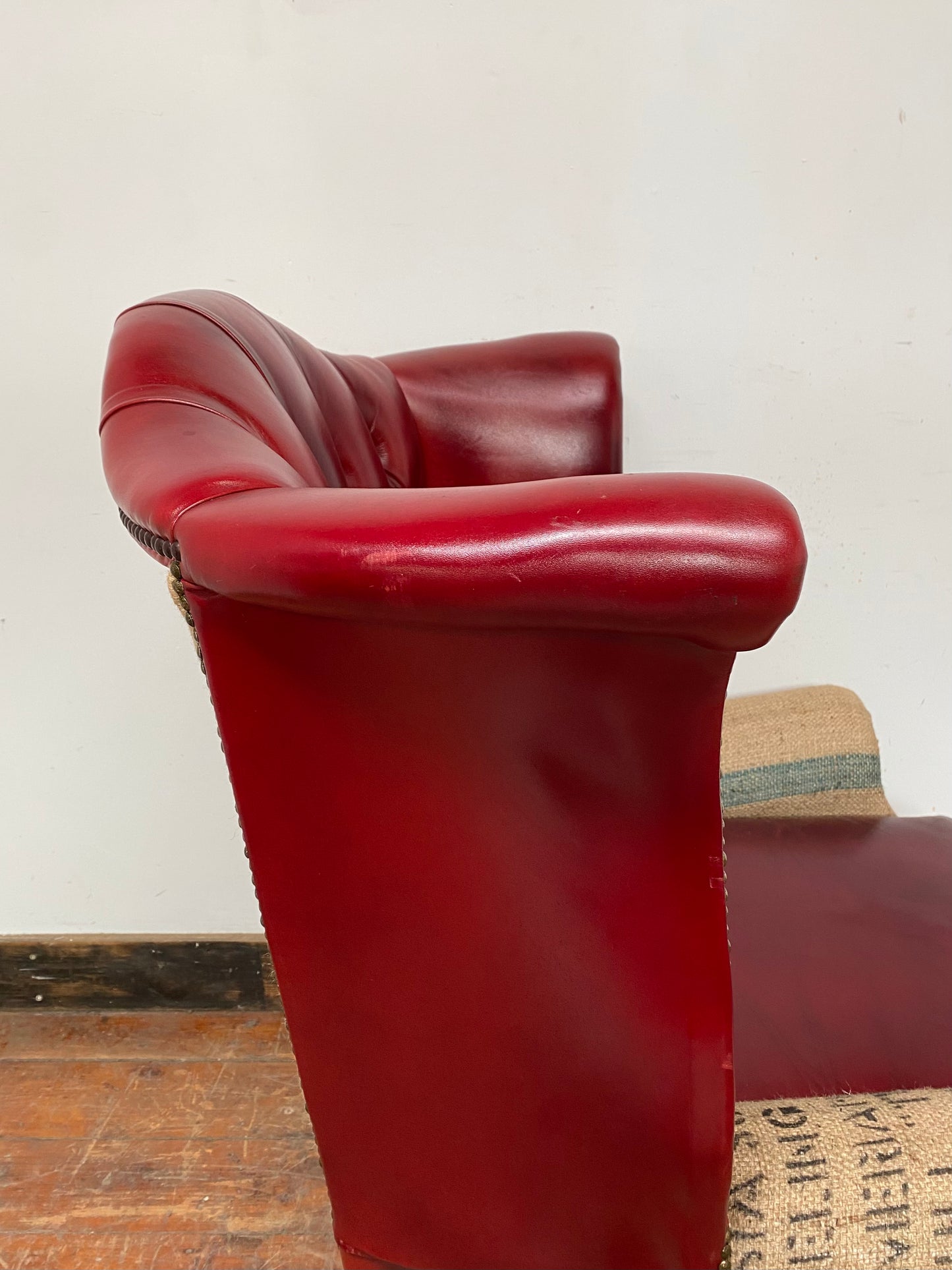 Deconstructed wingback armchair in red leather