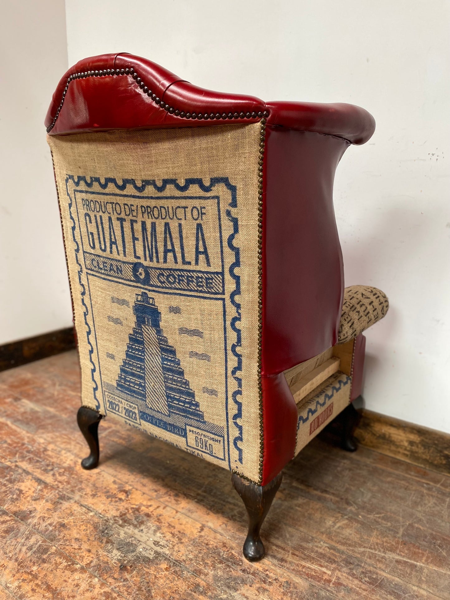 Deconstructed wingback armchair in red leather