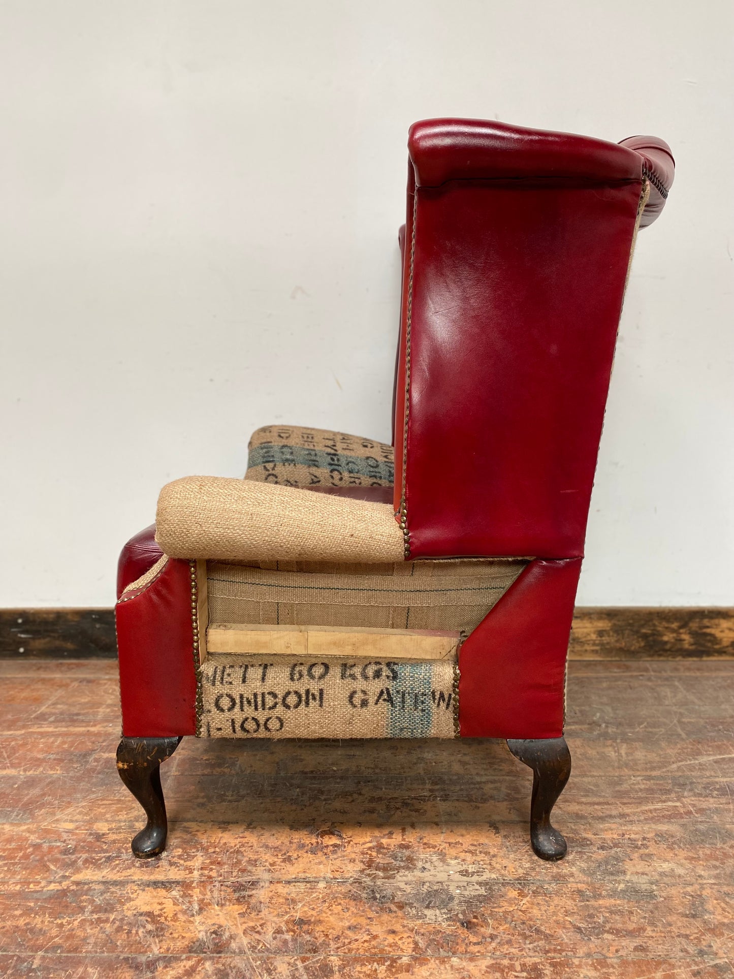 Deconstructed wingback armchair in red leather