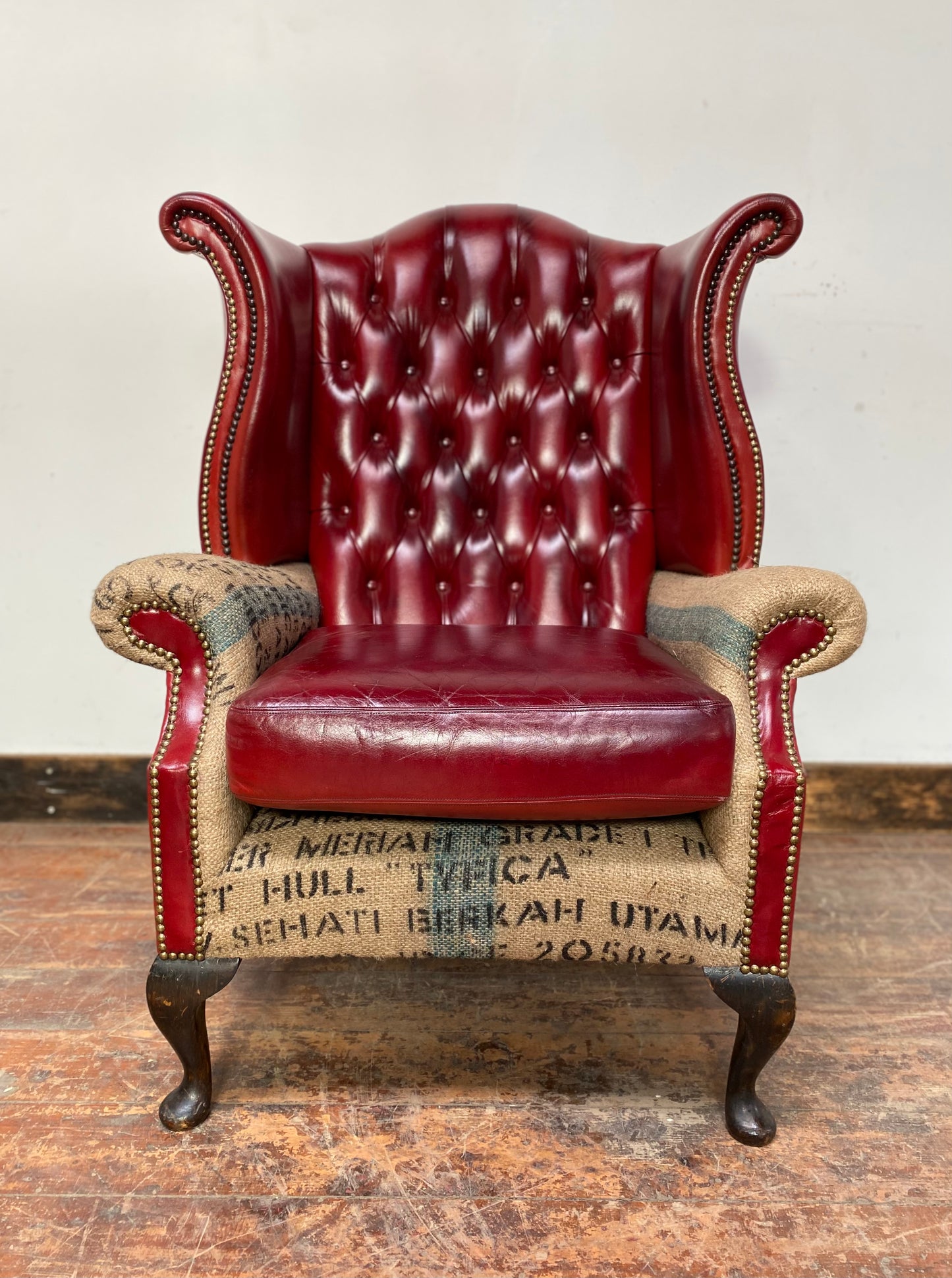 Deconstructed wingback armchair in red leather