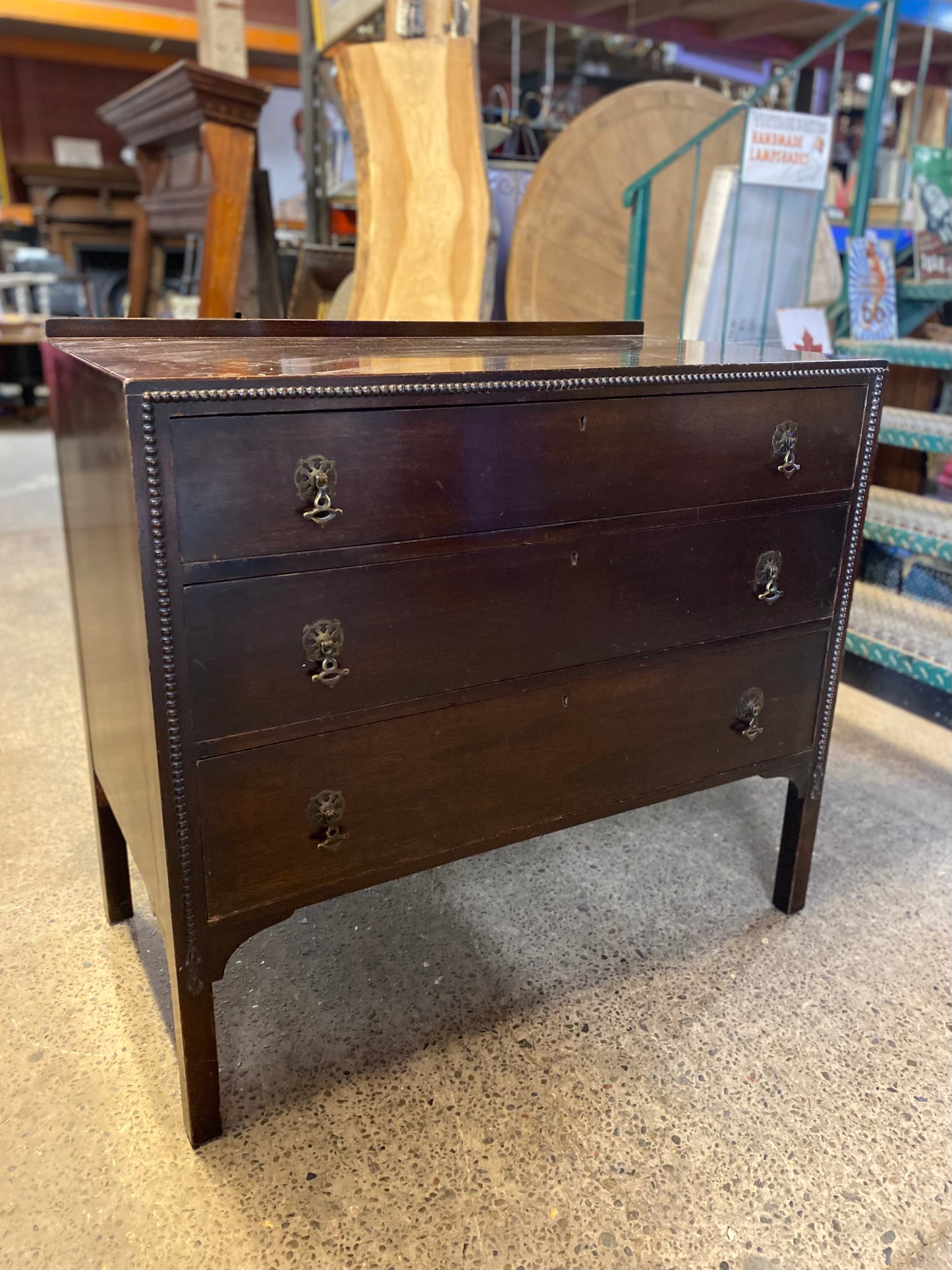 Small vintage chest of drawers in dark wood