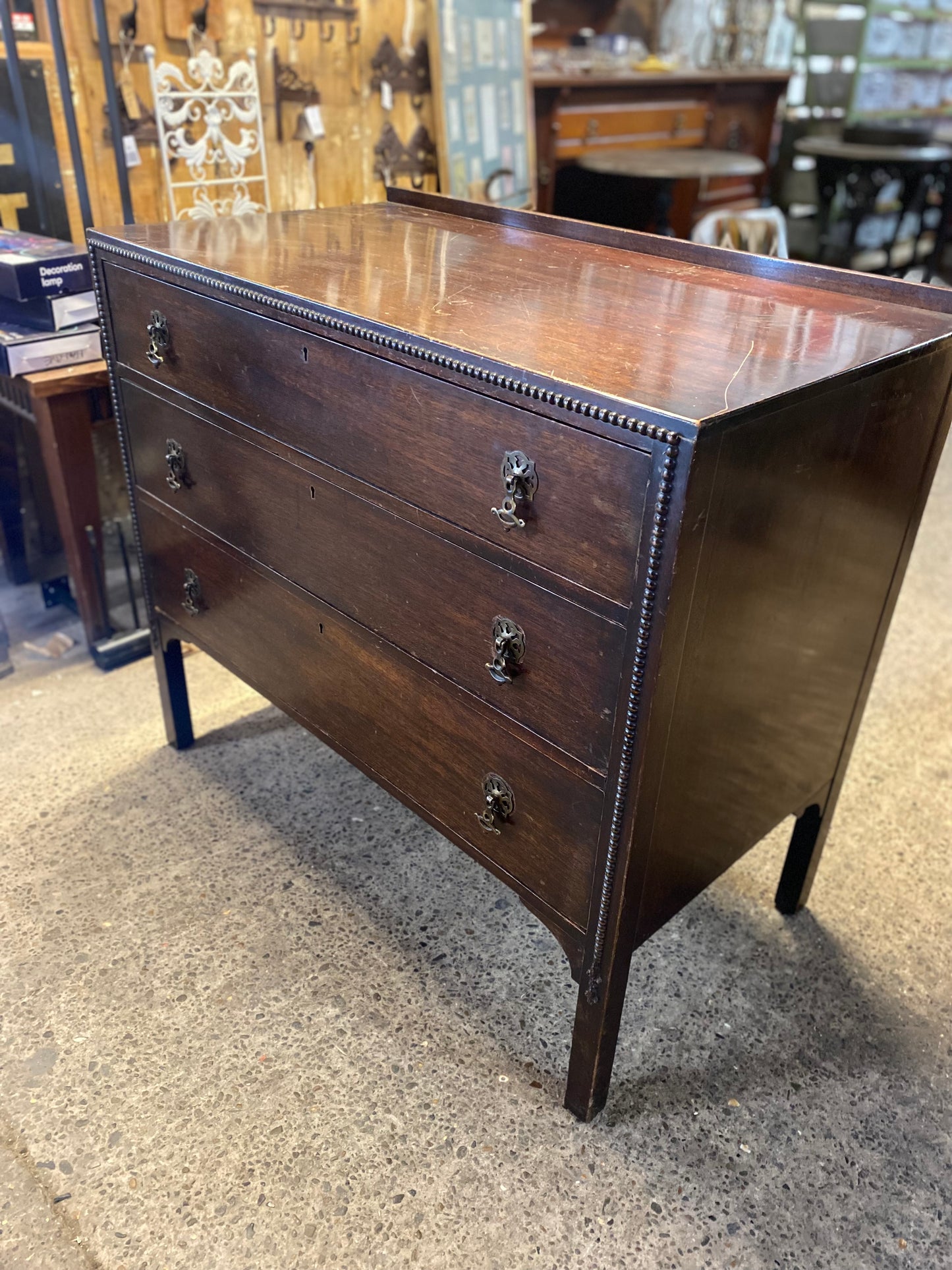 Small vintage chest of drawers in dark wood