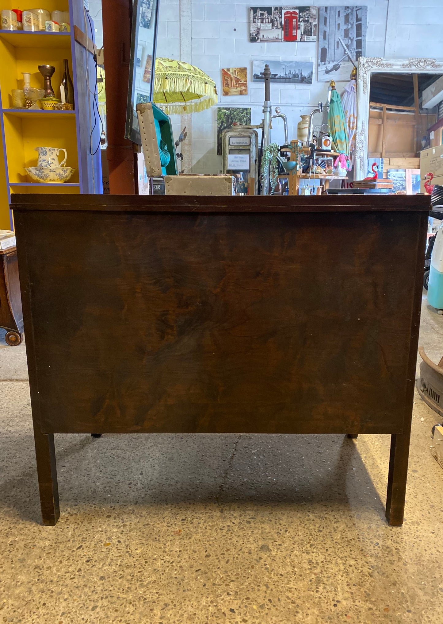 Small vintage chest of drawers in dark wood