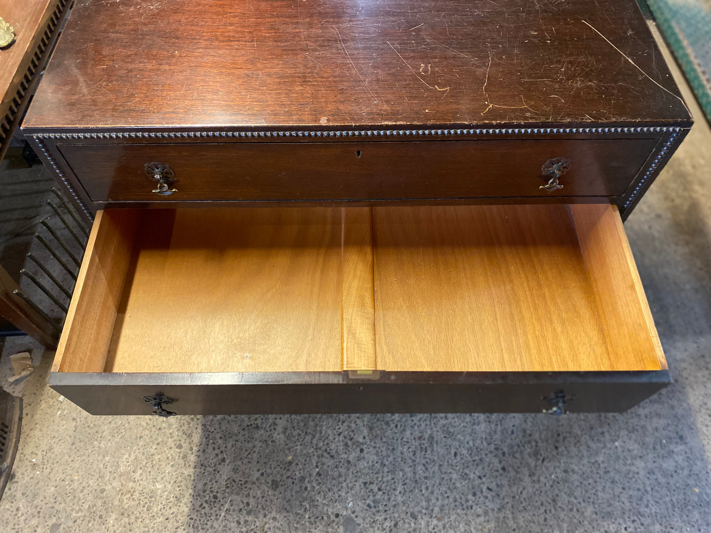 Small vintage chest of drawers in dark wood