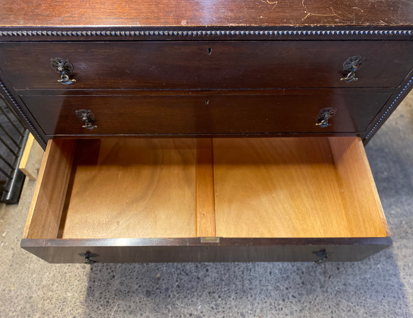 Small vintage chest of drawers in dark wood