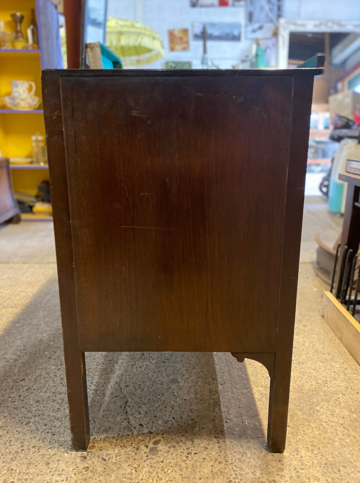 Small vintage chest of drawers in dark wood