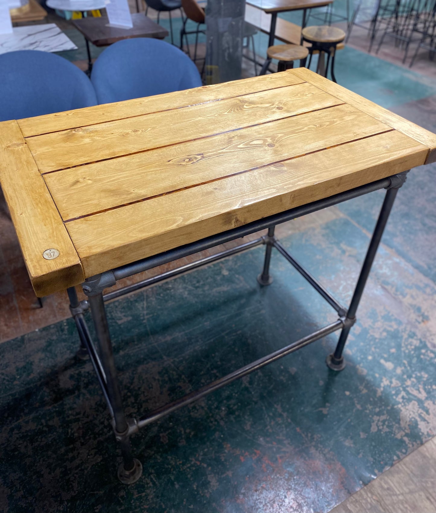 Poseur table with industrial metal base