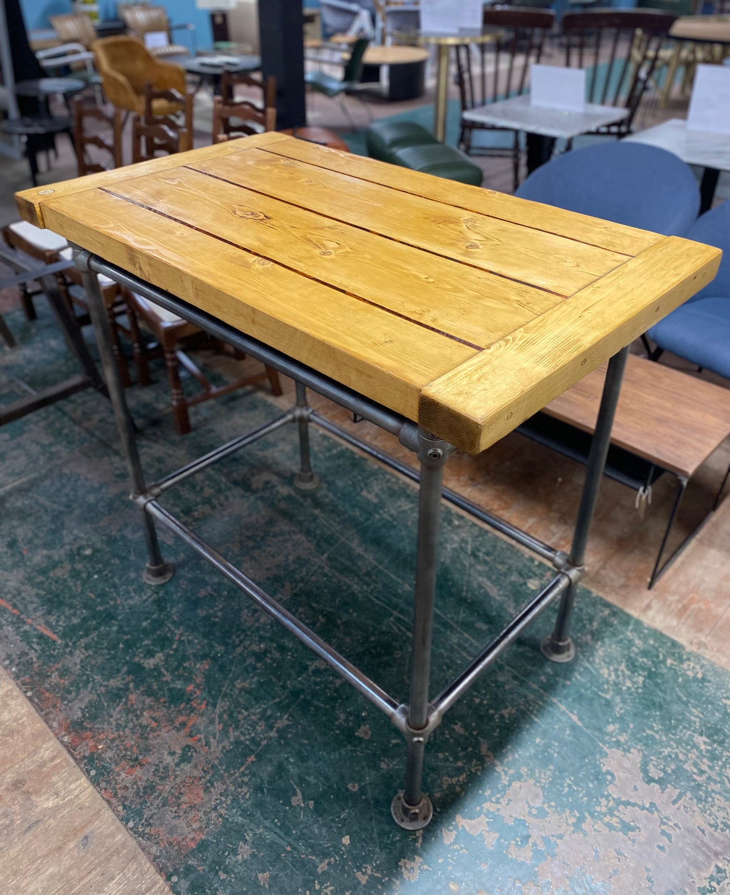 Poseur table with industrial metal base