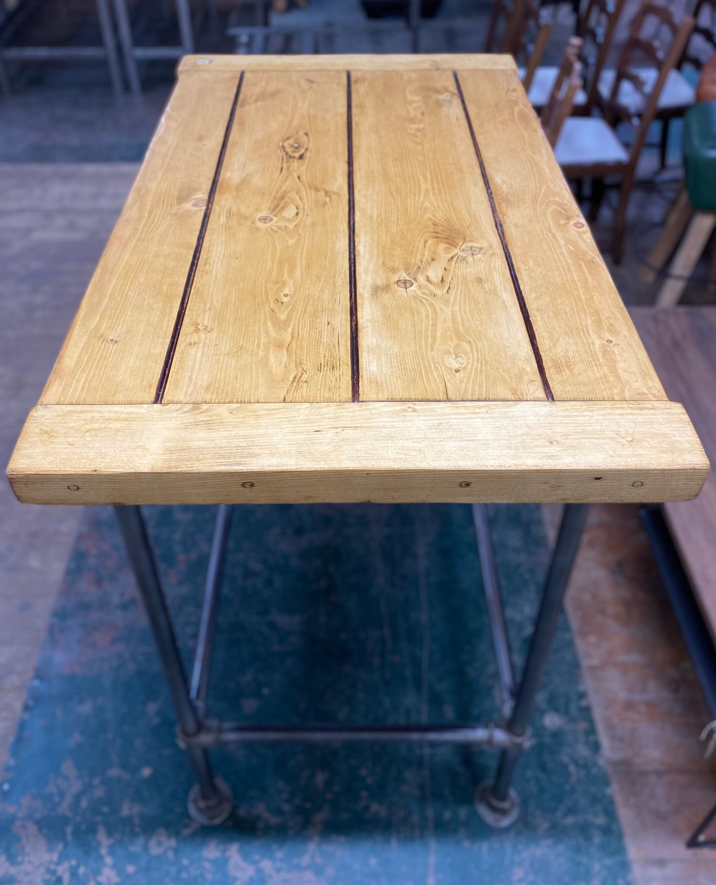 Poseur table with industrial metal base