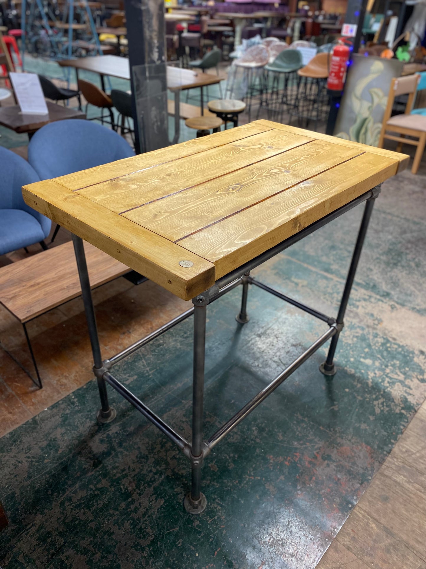 Poseur table with industrial metal base