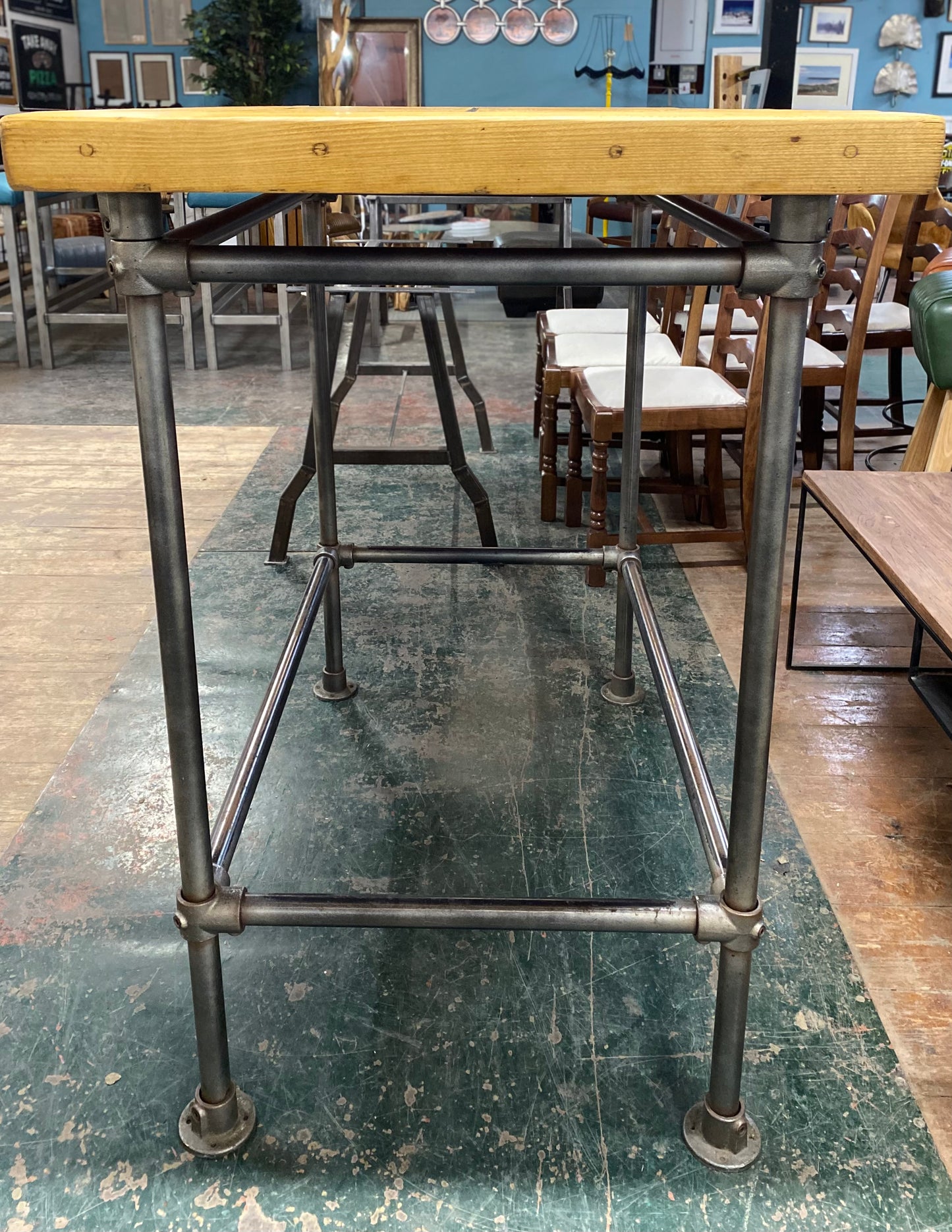 Poseur table with industrial metal base