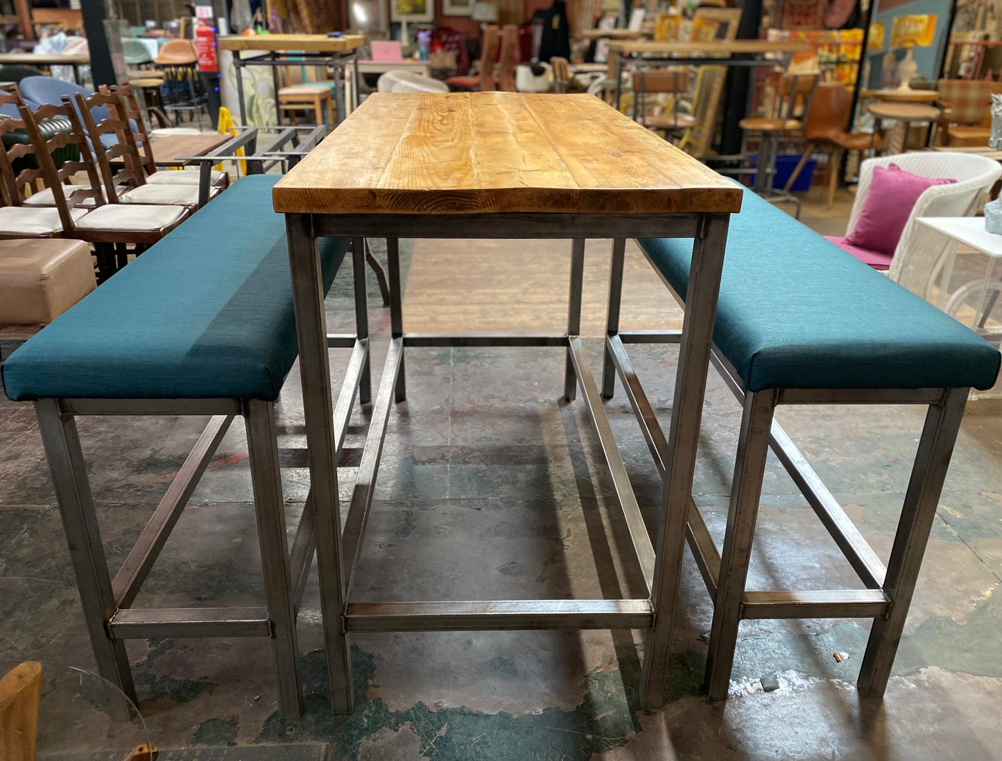 Industrial metal framed poseur table and benches