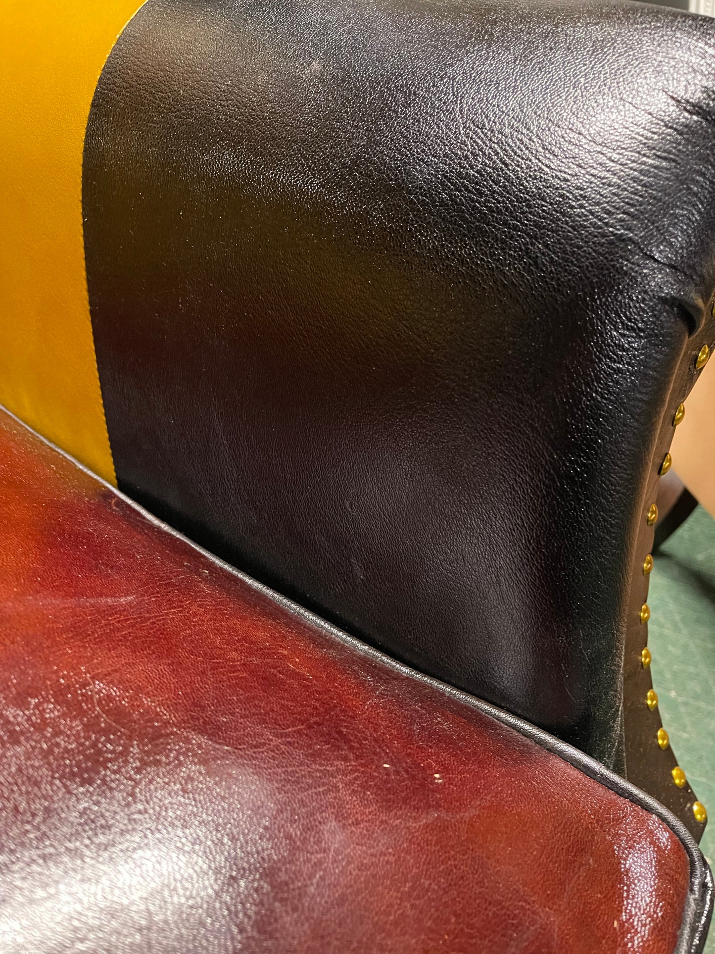 Colourful patchwork leather armchair with button back