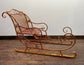 Large red and gold metal Christmas sleigh