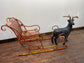 Red and gold Christmas sleigh including reindeer figure