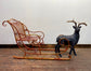 Red and gold Christmas sleigh including reindeer figure