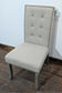 Set of Four Off-White Fabric Upholstered Dining Chairs / Brass Studs