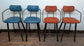 Set of 4 mixed colour bar stools (2 teal, 2 orange) for cafe / pub / restaurant
