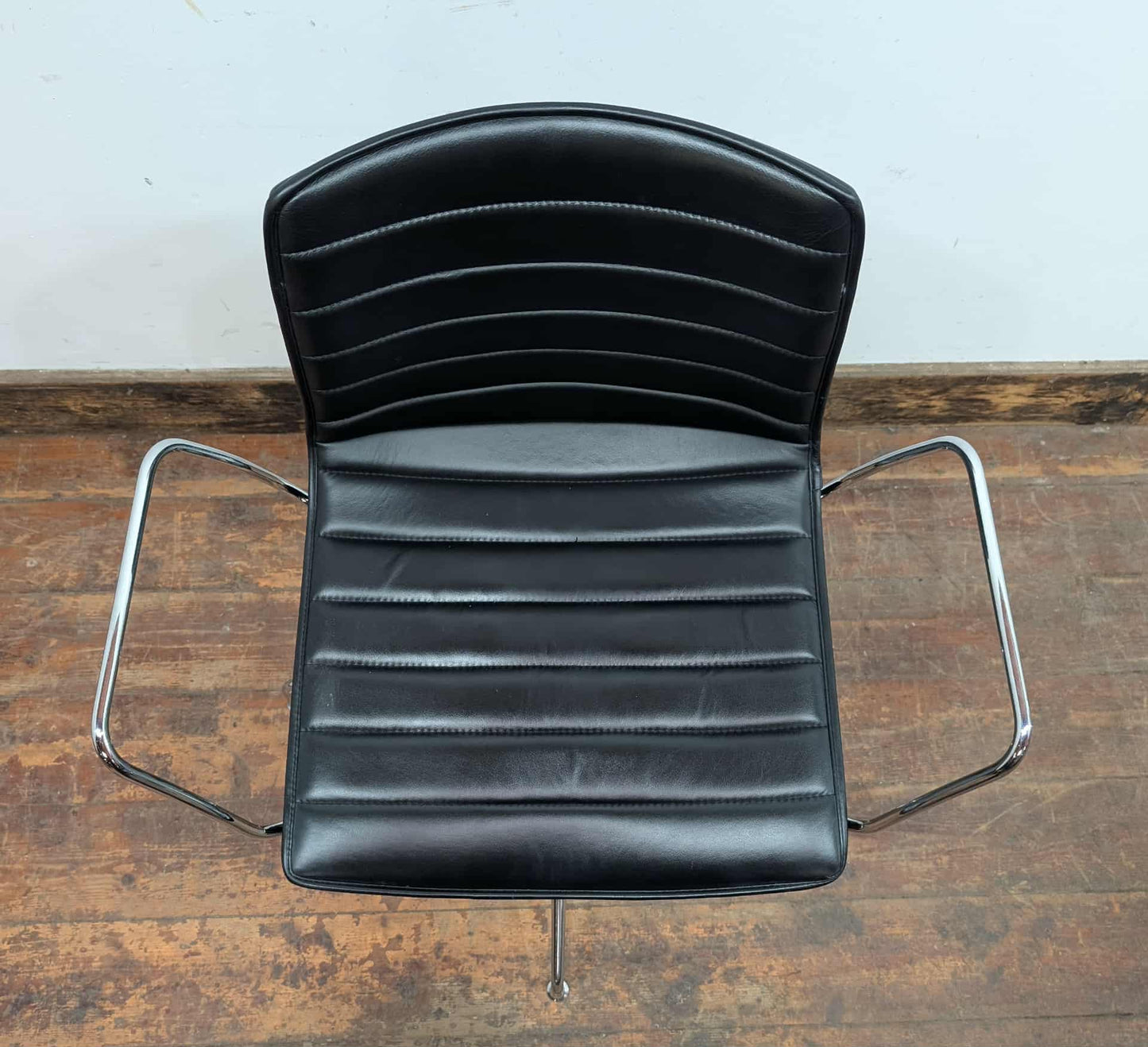 Set of 11 black faux leather swivel chairs with chrome frames