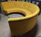Large Circular Booth Seating in Mustard Yellow with Wooden Legs