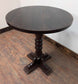 Medium Round Poseur Table with Decorative Column Base and Dark Wood Finish