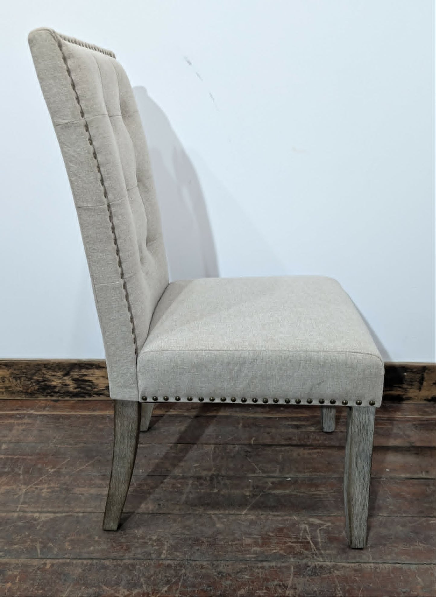Set of Four Off-White Fabric Upholstered Dining Chairs / Brass Studs