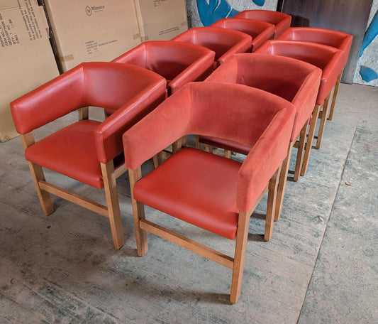 Set of 9 orange faux-leather and fabric tub chairs for cafe / pub / restaurant
