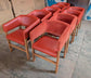 Set of 9 orange faux-leather and fabric tub chairs for cafe / pub / restaurant