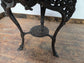 Medium Round Dining Table with Ornate Cast Iron Base and Light Wood Top