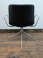 Set of 11 black faux leather swivel chairs with chrome frames