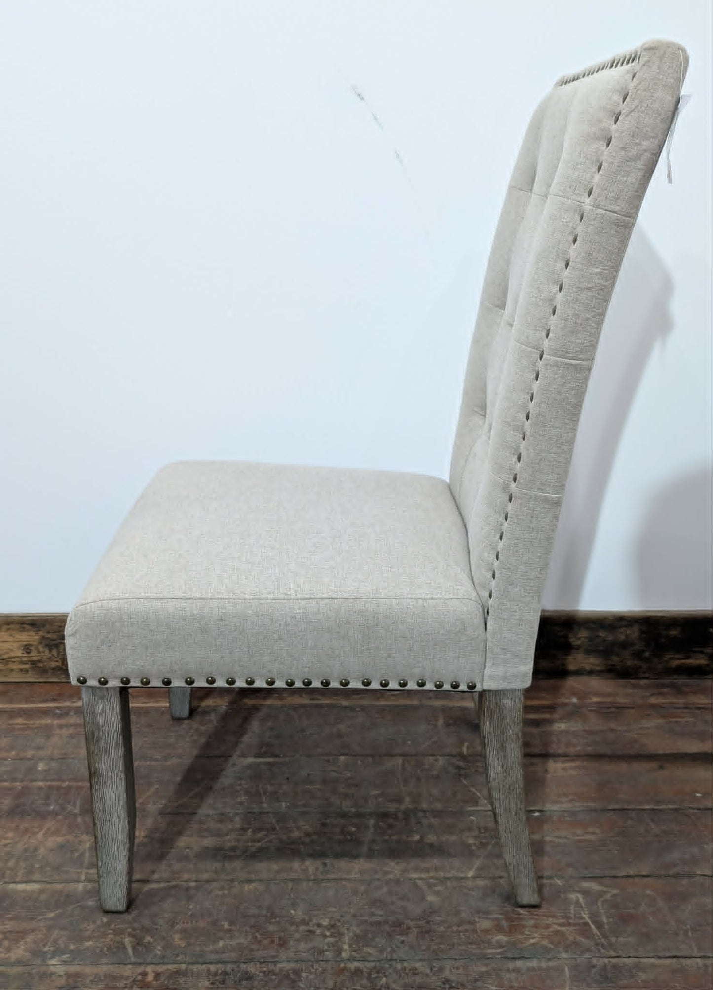 Set of Four Off-White Fabric Upholstered Dining Chairs / Brass Studs