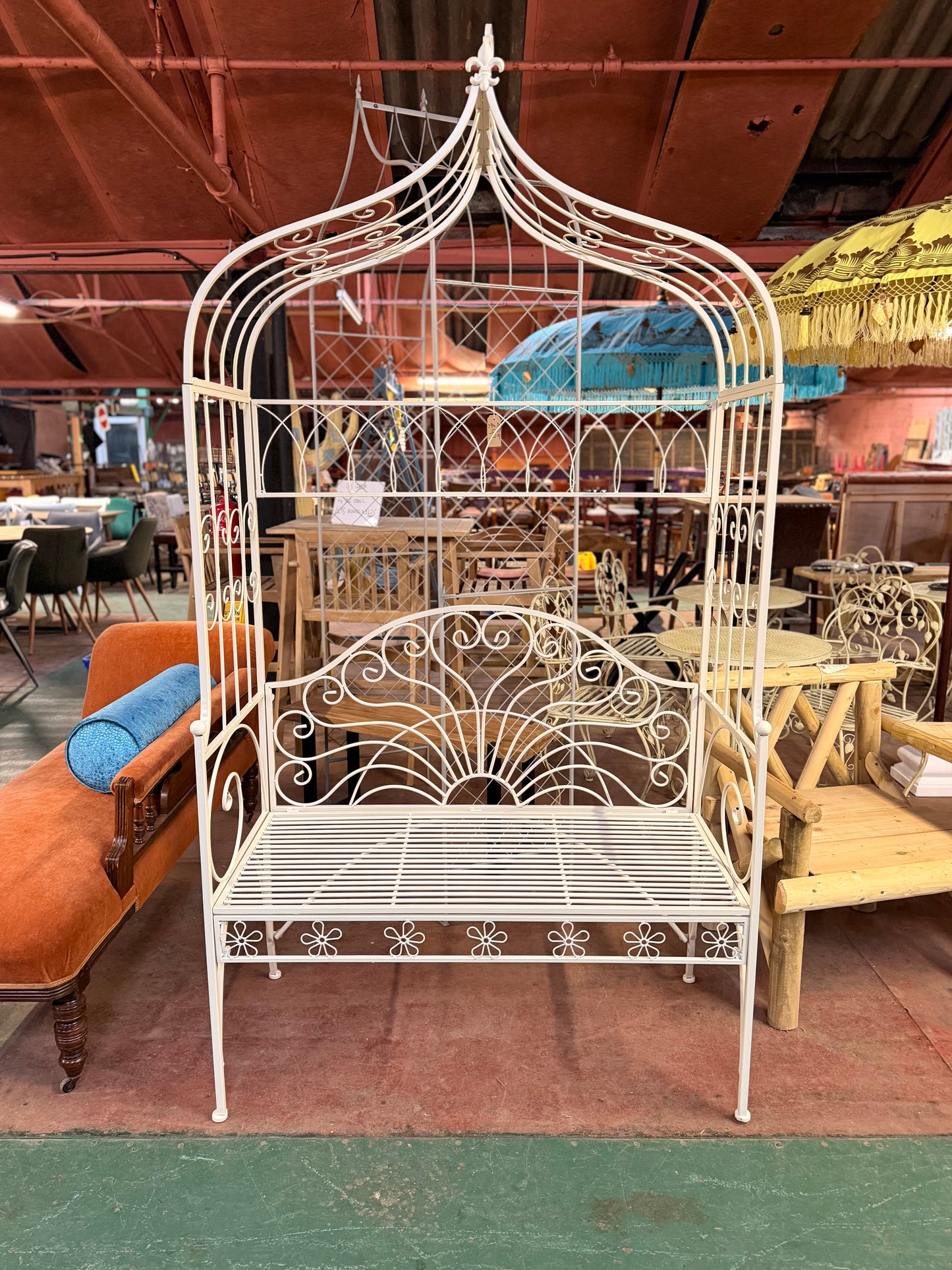 Beautiful white metal garden bench and arch
