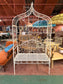 Beautiful white metal garden bench and arch
