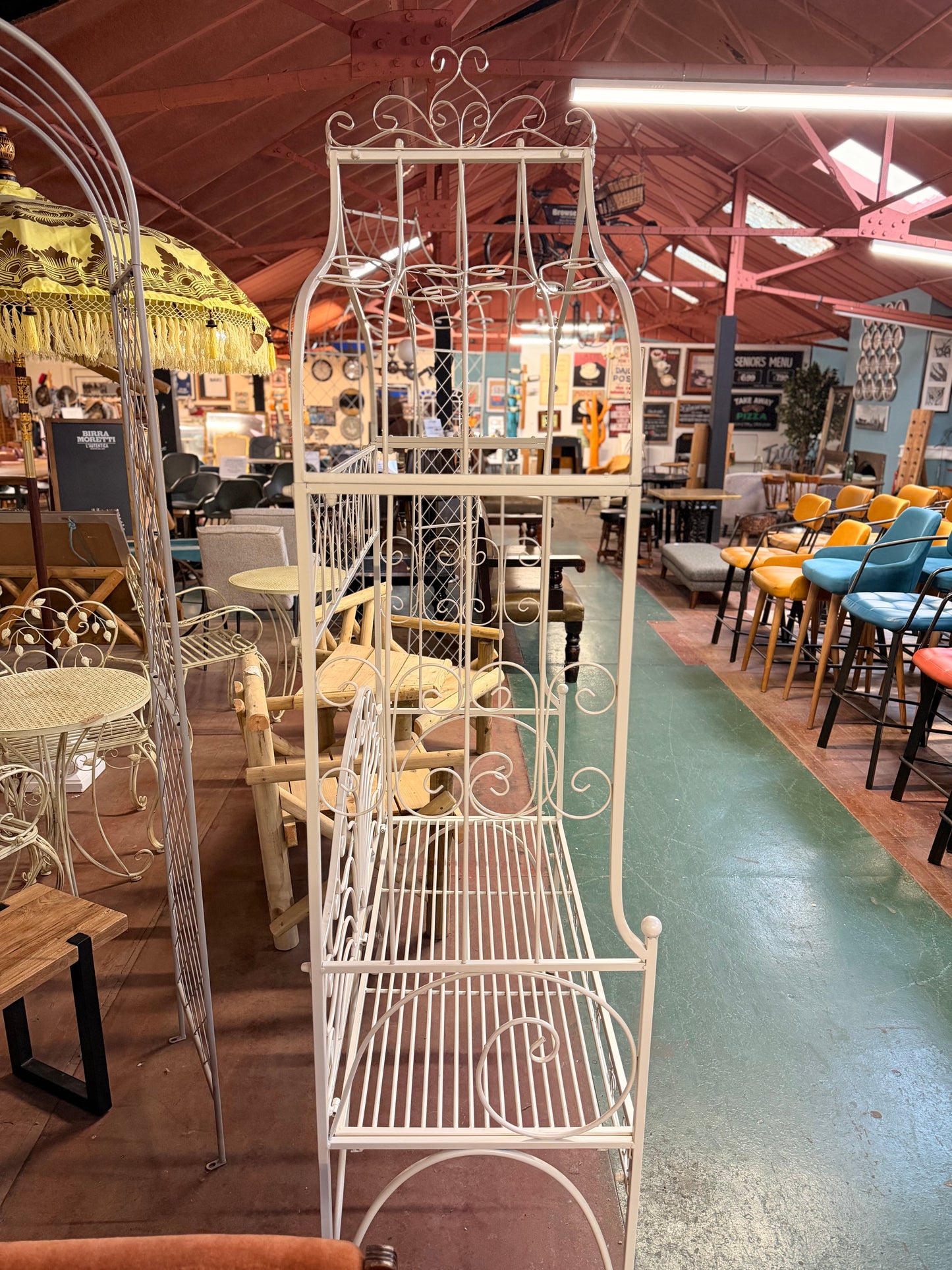 Beautiful white metal garden bench and arch