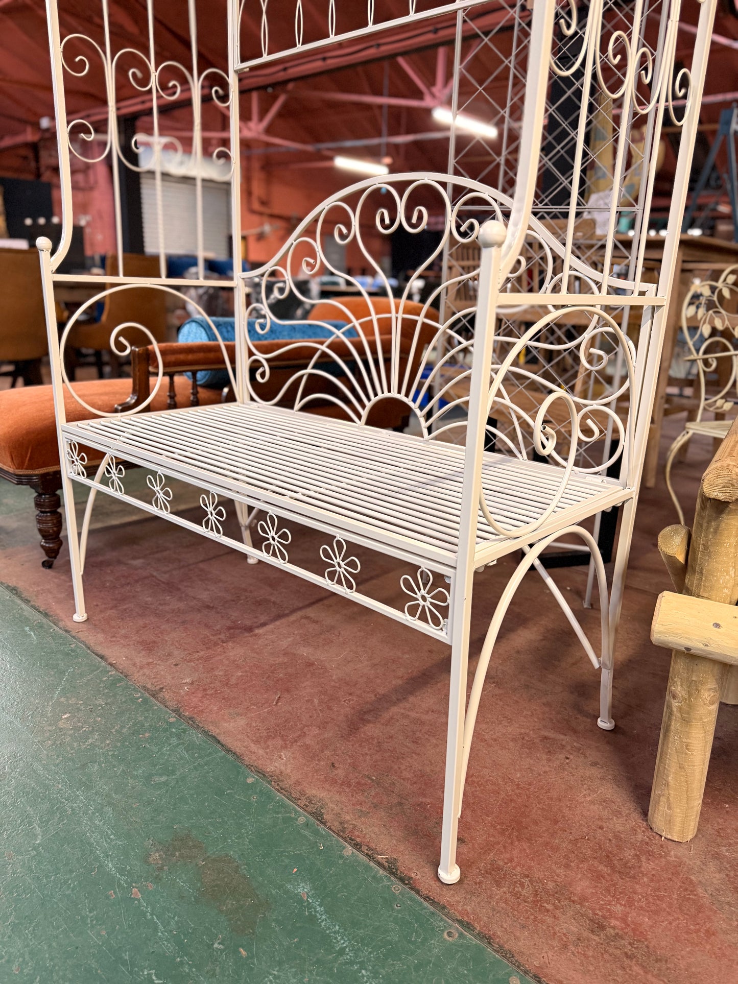 Beautiful white metal garden bench and arch