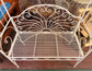 Beautiful white metal garden bench and arch