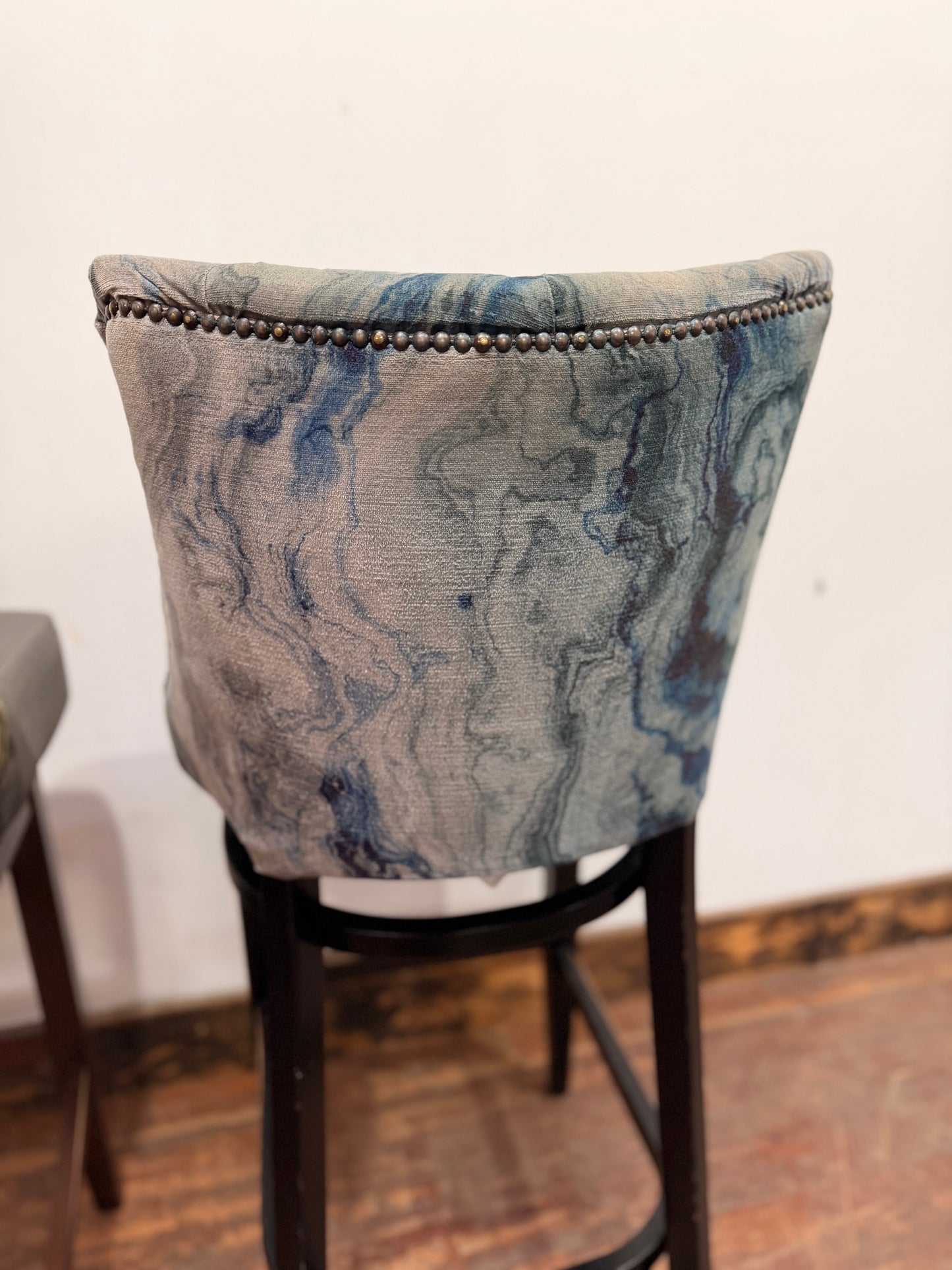 Pair of bar stools with marble effect fabric backs