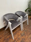 Pair of grey suede-feel chairs with white painted frames